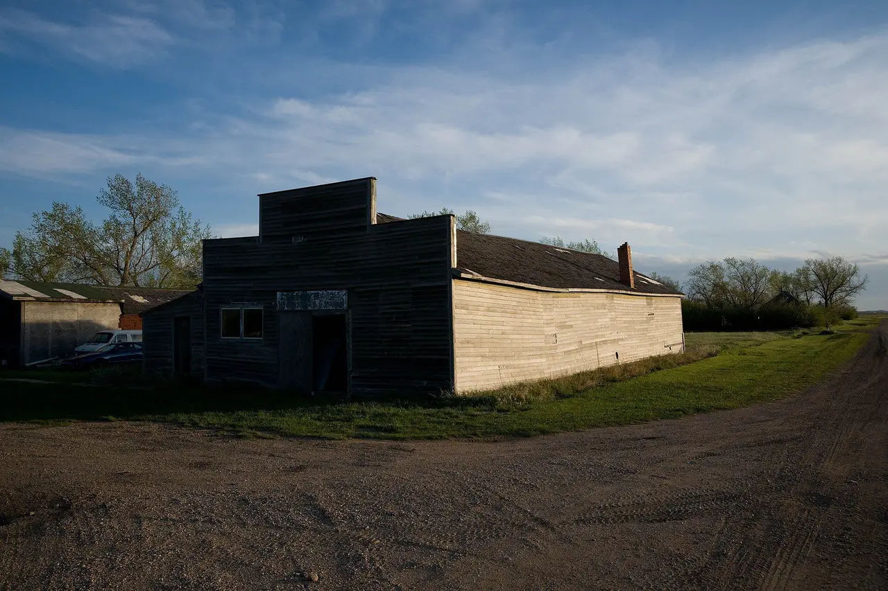 Old false-front building on a gravel road, 2009